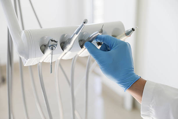 Professional Tooth Extraction technician working in Highland, MD